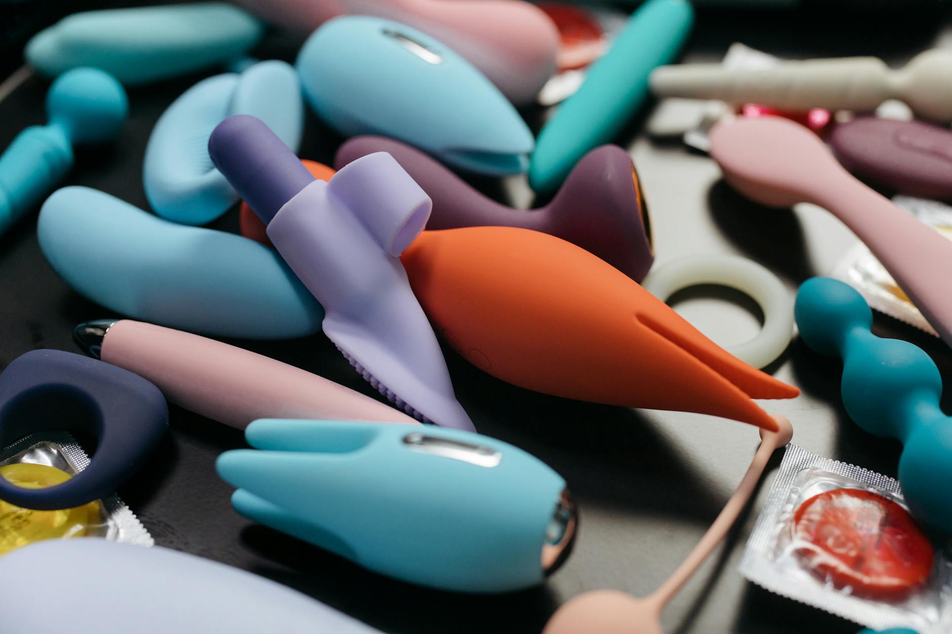 An array of vibrant adult toys including vibrators in close-up view